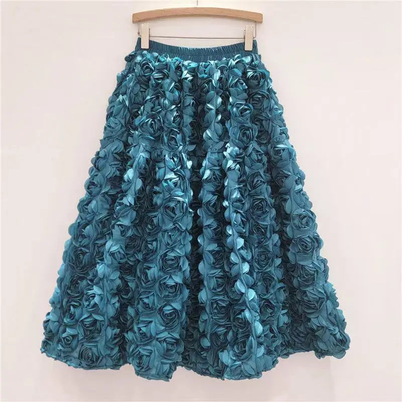 Falda para mujer Verano 2025 Versátil Flor tridimensional Falda a media pantorrilla Cintura alta Gran vuelo Moda Faldas largas estilo A