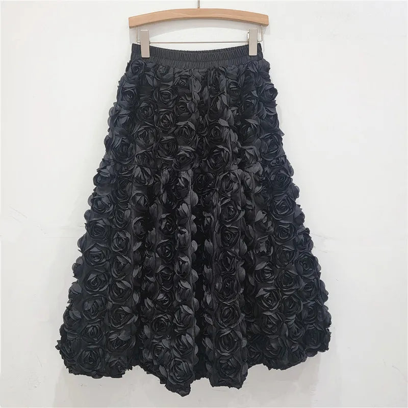 Falda para mujer Verano 2025 Versátil Flor tridimensional Falda a media pantorrilla Cintura alta Gran vuelo Moda Faldas largas estilo A
