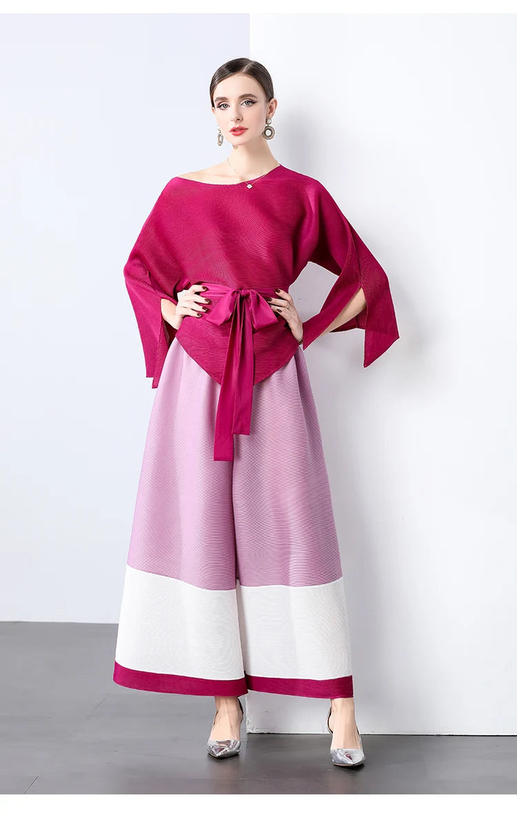 Conjunto de dos piezas de moda femenina para primavera, top suelto plisado irregular con retazos y cinturón, y pantalones de pierna ancha Miyake 2024