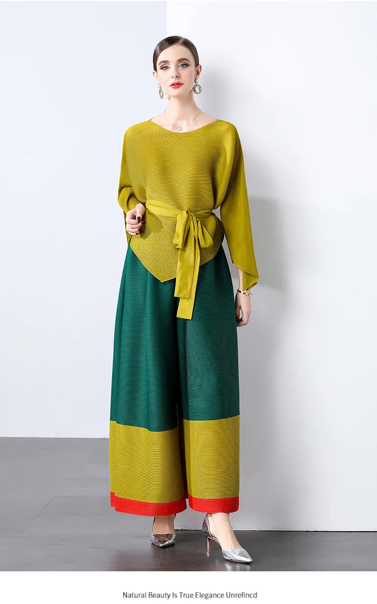 Conjunto de dos piezas de moda femenina para primavera, top suelto plisado irregular con retazos y cinturón, y pantalones de pierna ancha Miyake 2024