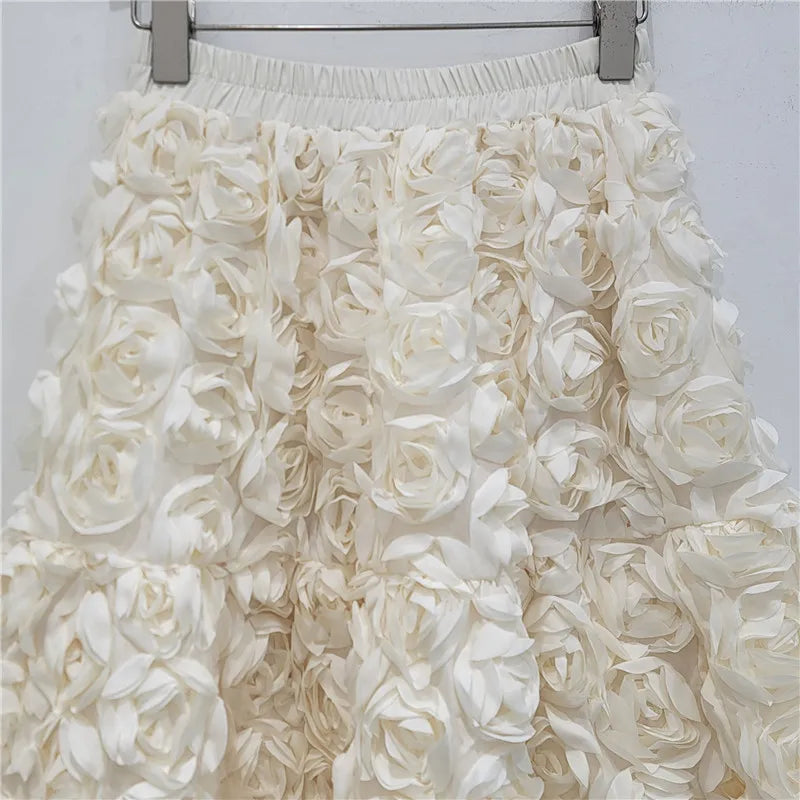 Falda para mujer Verano 2025 Versátil Flor tridimensional Falda a media pantorrilla Cintura alta Gran vuelo Moda Faldas largas estilo A
