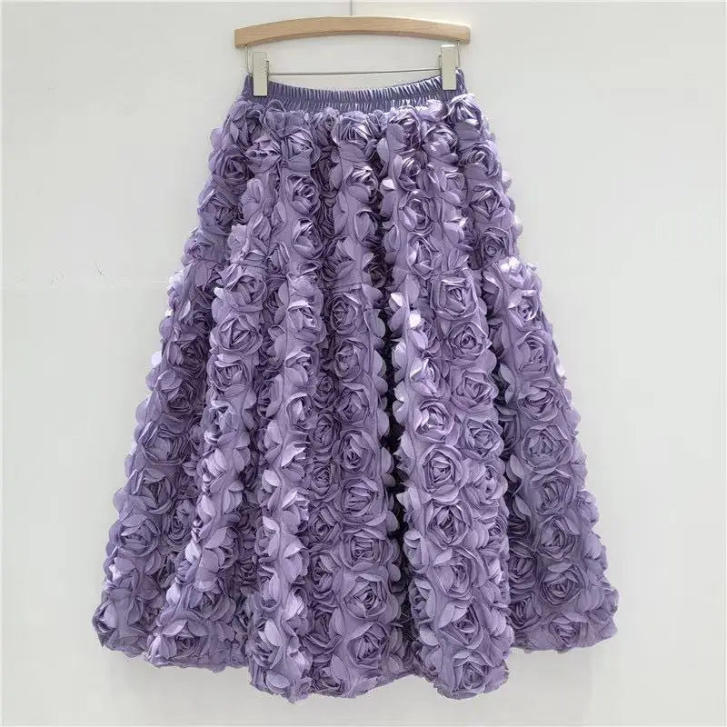 Falda para mujer Verano 2025 Versátil Flor tridimensional Falda a media pantorrilla Cintura alta Gran vuelo Moda Faldas largas estilo A