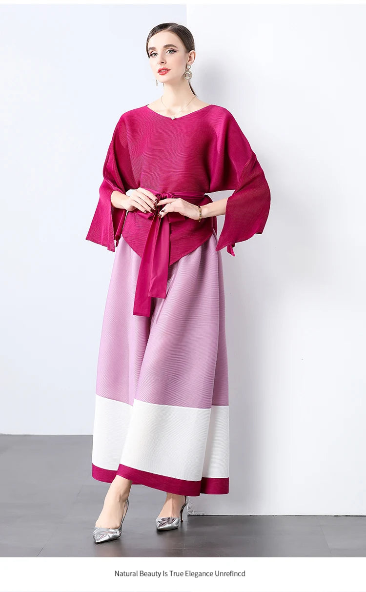 Conjunto de dos piezas de moda femenina para primavera, top suelto plisado irregular con retazos y cinturón, y pantalones de pierna ancha Miyake 2024