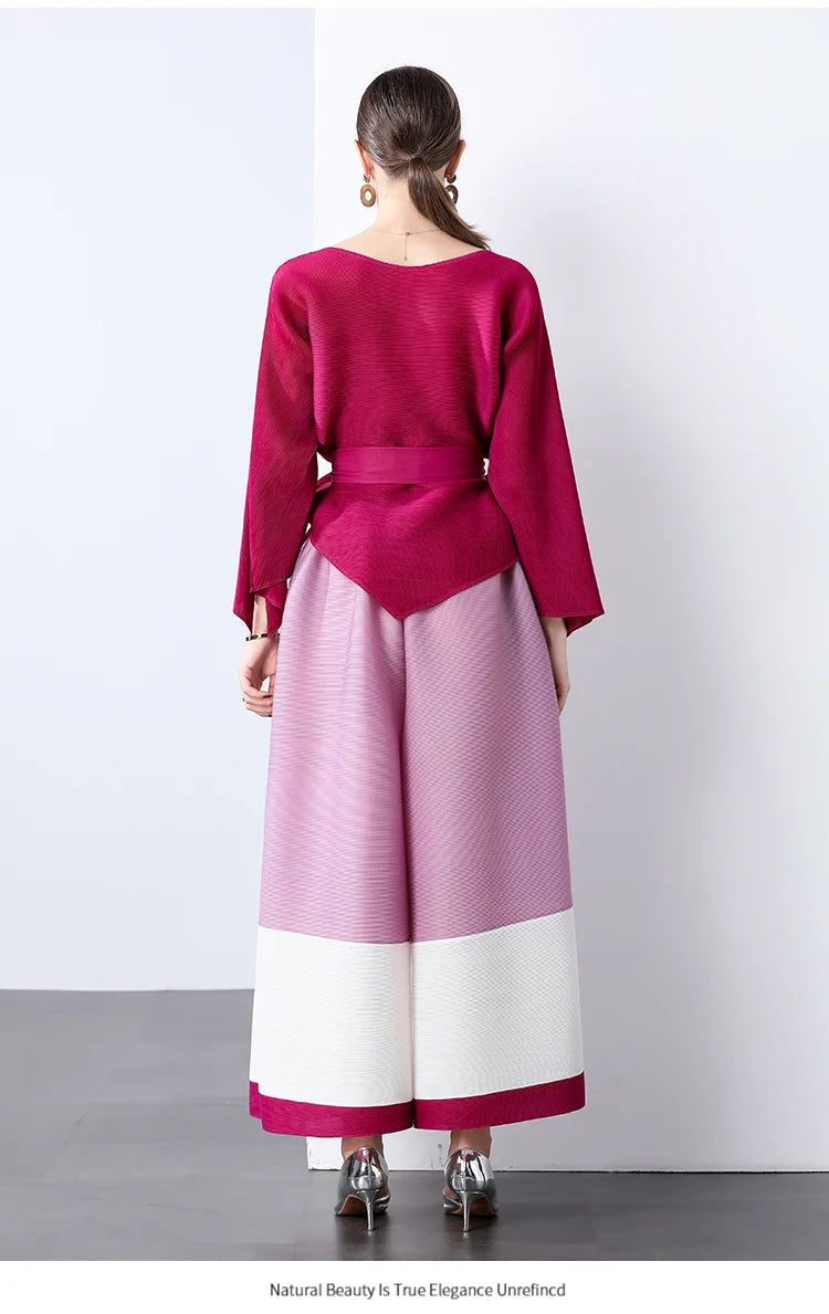 Conjunto de dos piezas de moda femenina para primavera, top suelto plisado irregular con retazos y cinturón, y pantalones de pierna ancha Miyake 2024