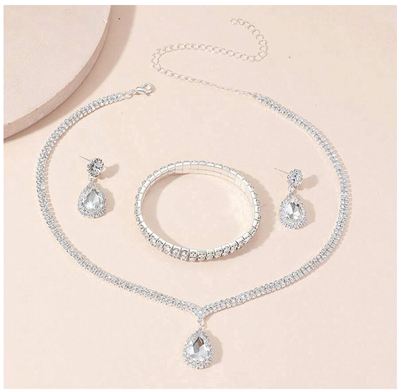 Juego de joyas lujosas de 4 piezas, exquisito colgante de diamantes de imitación, elegante collar, pendientes y pulsera chapados en plata con cristales para mujer