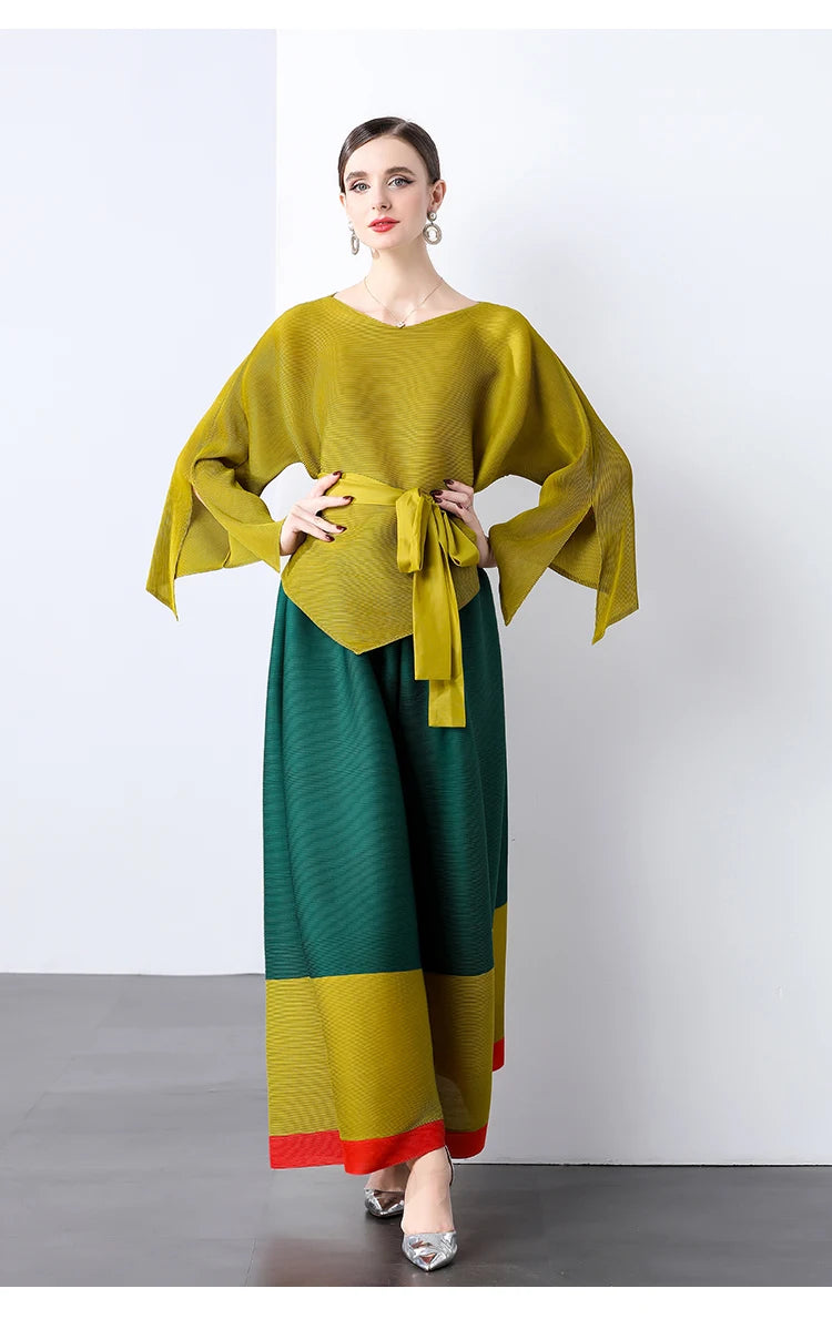 Conjunto de dos piezas de moda femenina para primavera, top suelto plisado irregular con retazos y cinturón, y pantalones de pierna ancha Miyake 2024