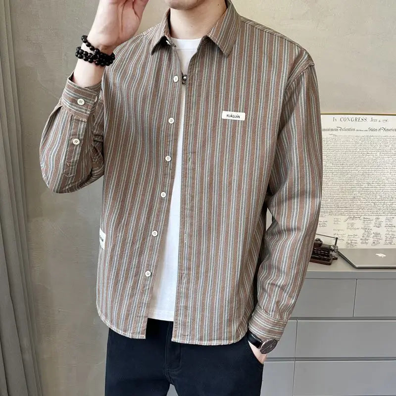 Camisa de rayas de manga larga para hombre, nueva camisa versátil de moda con rayas verticales, a la moda