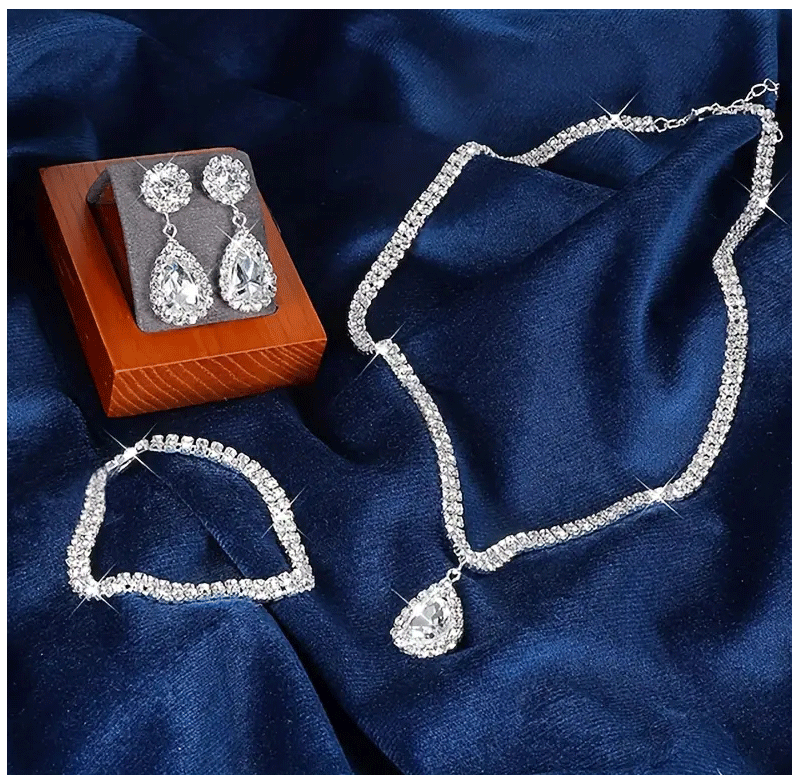 Juego de joyas lujosas de 4 piezas, exquisito colgante de diamantes de imitación, elegante collar, pendientes y pulsera chapados en plata con cristales para mujer