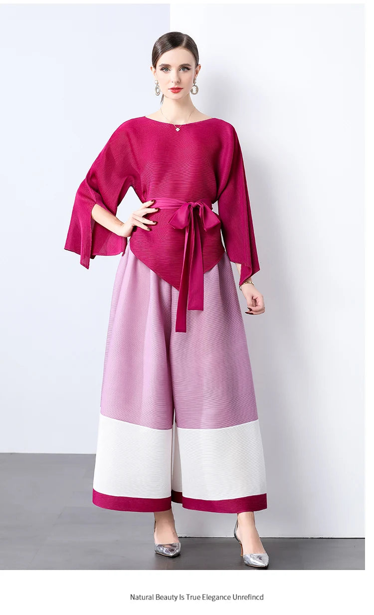 Conjunto de dos piezas de moda femenina para primavera, top suelto plisado irregular con retazos y cinturón, y pantalones de pierna ancha Miyake 2024