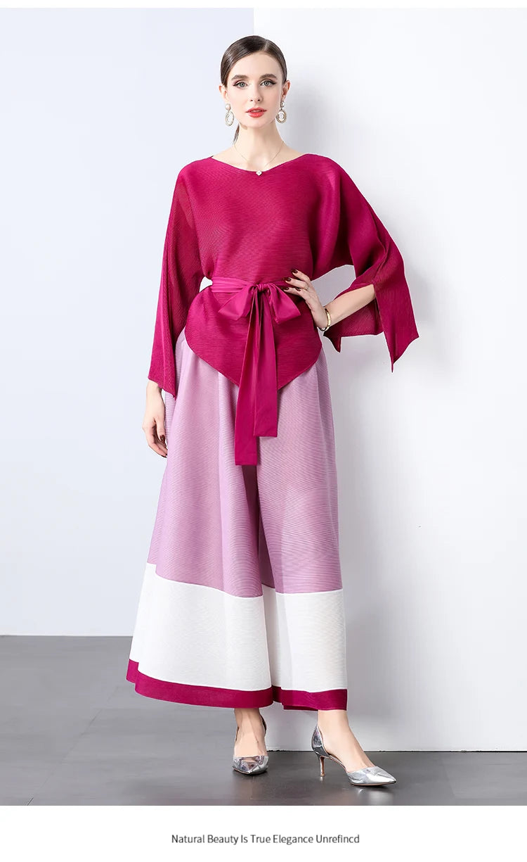 Conjunto de dos piezas de moda femenina para primavera, top suelto plisado irregular con retazos y cinturón, y pantalones de pierna ancha Miyake 2024
