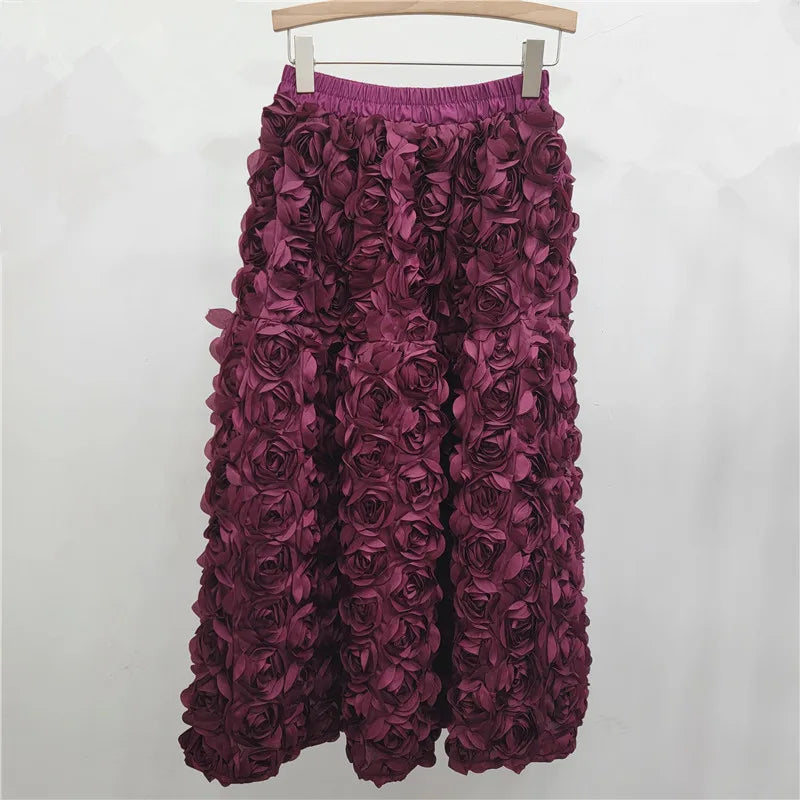 Falda para mujer Verano 2025 Versátil Flor tridimensional Falda a media pantorrilla Cintura alta Gran vuelo Moda Faldas largas estilo A