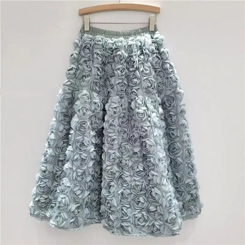 Falda para mujer Verano 2025 Versátil Flor tridimensional Falda a media pantorrilla Cintura alta Gran vuelo Moda Faldas largas estilo A