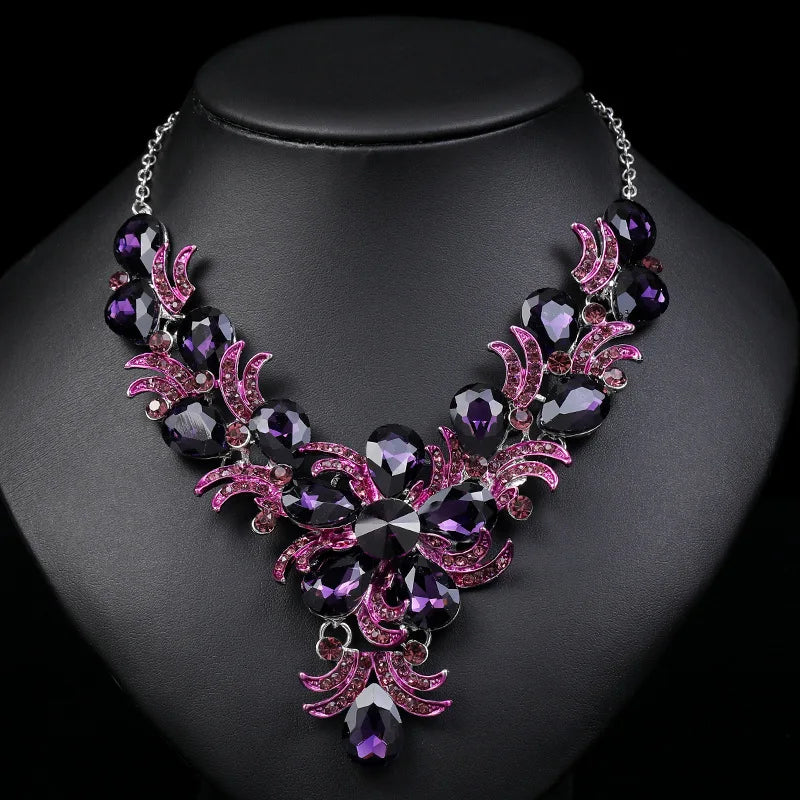 Juego de joyería morada al por mayor Accesorios de boda Lujo Cristal Rhinestone Flor Pendientes y Collar llamativos para mujer
