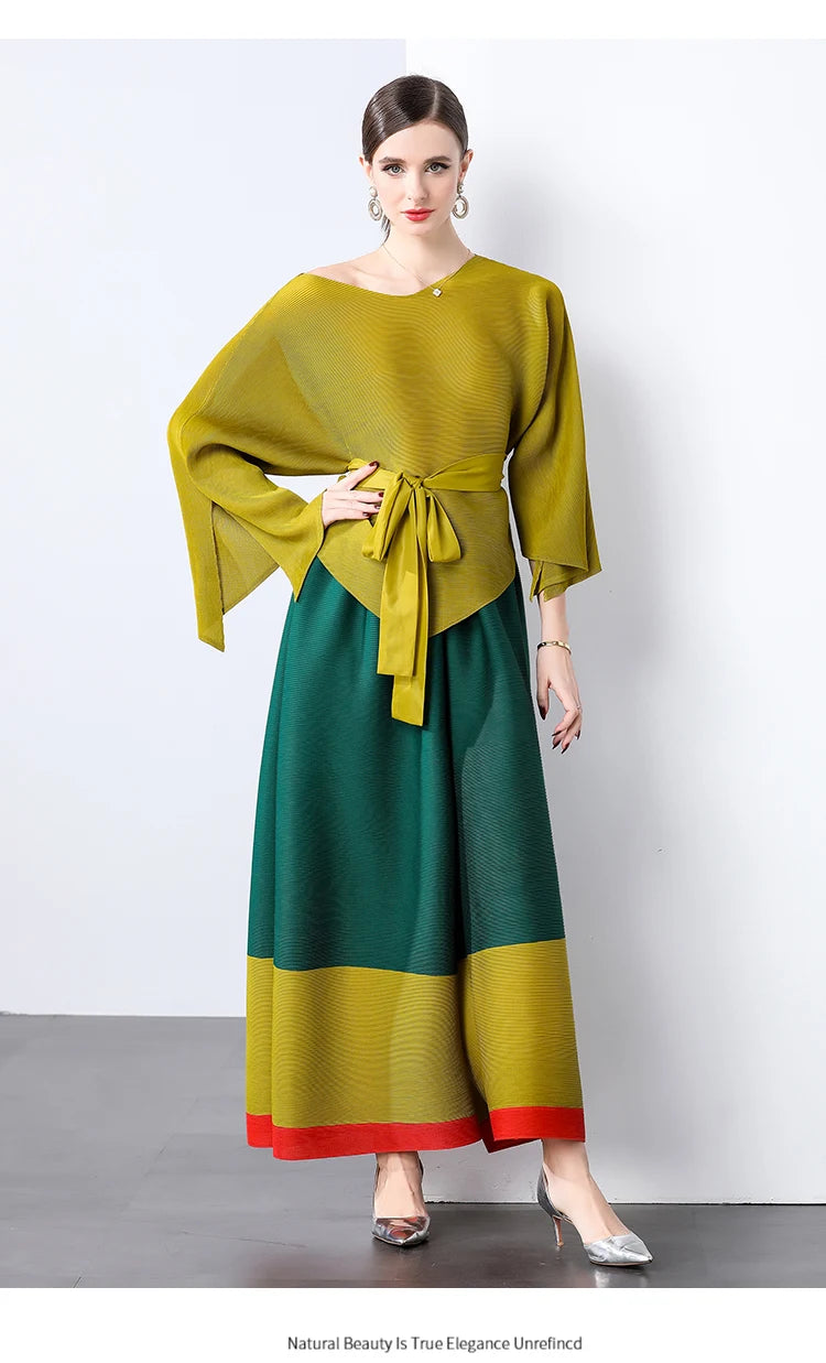 Conjunto de dos piezas de moda femenina para primavera, top suelto plisado irregular con retazos y cinturón, y pantalones de pierna ancha Miyake 2024