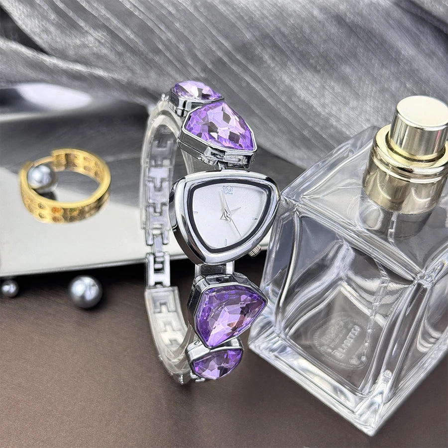 Reloj de cuarzo vanguardista de moda con esfera de patrón solar simple, pedrería brillante de forma irregular y diseño especial para mujer