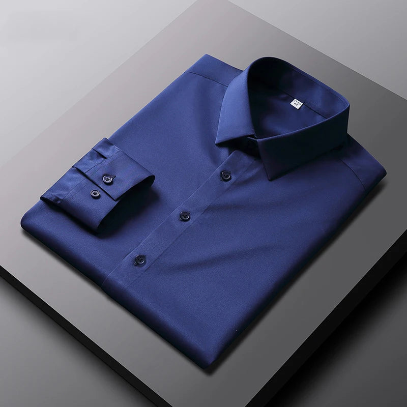 Camisa de manga larga de color liso para hombre, informal y a la moda, que no necesita planchado y es resistente a las arrugas, top de negocios