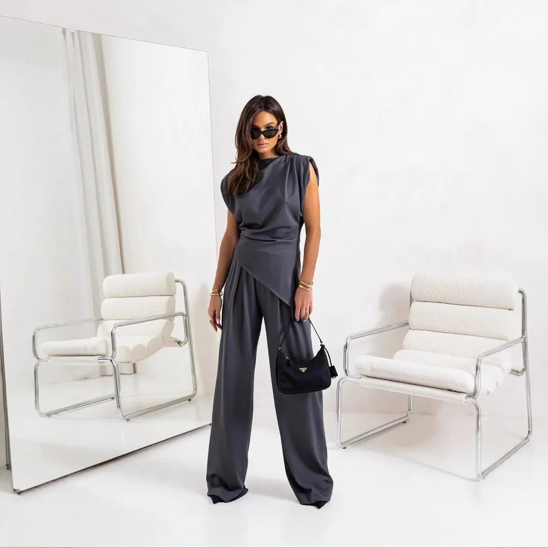 Traje de pantalones plisados asimétricos para mujer, blusa sexy sin mangas, pantalones de pierna recta de talle alto con bolsillos, conjunto de moda nuevo para verano