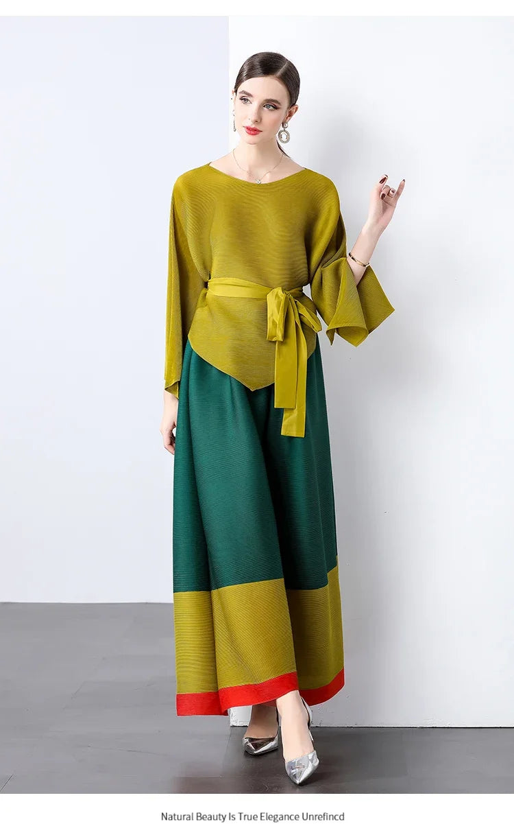 Conjunto de dos piezas de moda femenina para primavera, top suelto plisado irregular con retazos y cinturón, y pantalones de pierna ancha Miyake 2024
