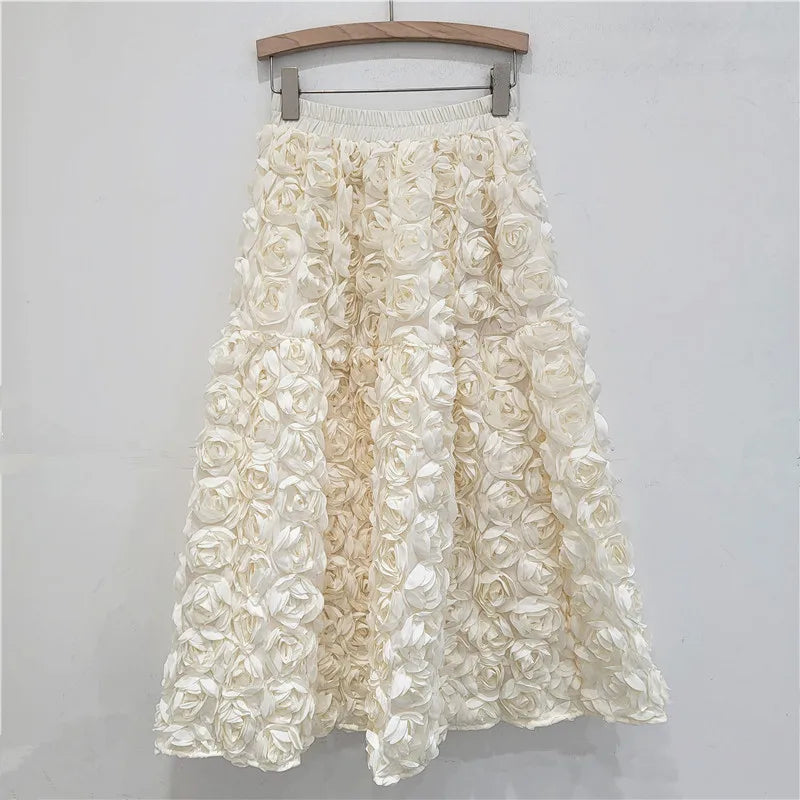 Falda para mujer Verano 2025 Versátil Flor tridimensional Falda a media pantorrilla Cintura alta Gran vuelo Moda Faldas largas estilo A