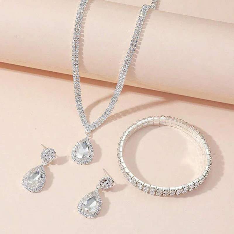Juego de joyas lujosas de 4 piezas, exquisito colgante de diamantes de imitación, elegante collar, pendientes y pulsera chapados en plata con cristales para mujer