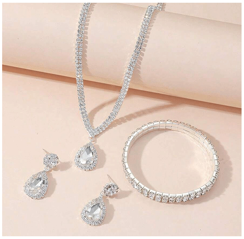 Juego de joyas lujosas de 4 piezas, exquisito colgante de diamantes de imitación, elegante collar, pendientes y pulsera chapados en plata con cristales para mujer