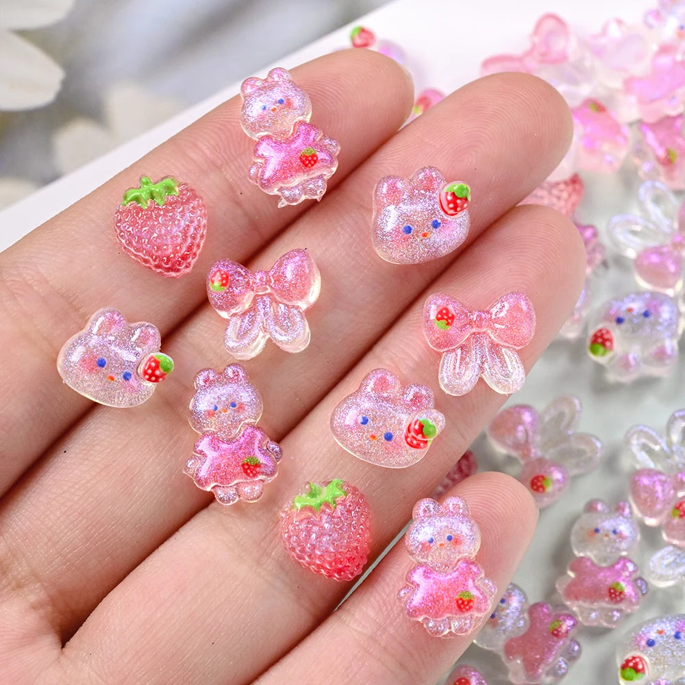 50 dijes de uñas de conejo fresa Kawaii, lazo, brillos, pajarita rosa, cinta de conejo, diamantes de imitación de uñas, piezas de uñas de conejo de dibujos animados de resina